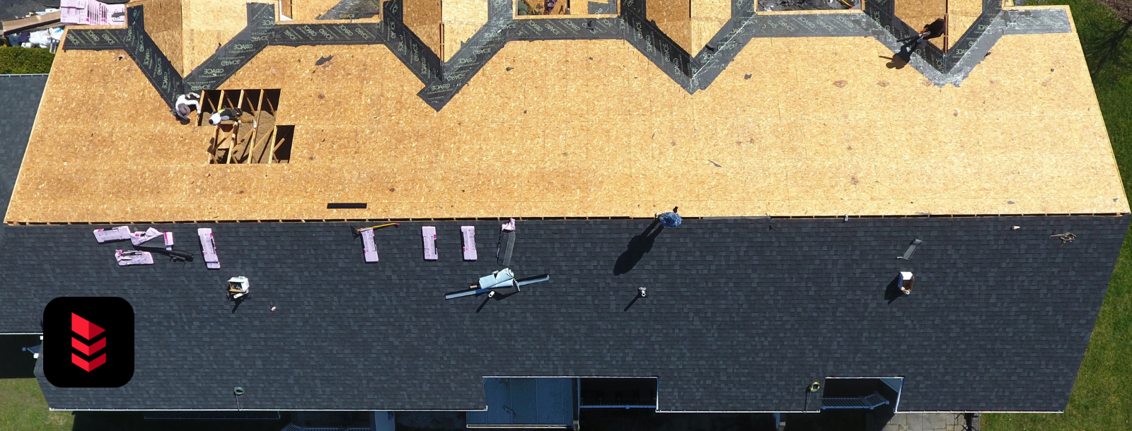 New shingle roof being installed on a New Hampshire apartment building by RoofPros.Plus